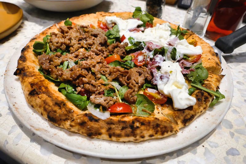 Rustic wall art decorating the interior of Pequod's Pizza